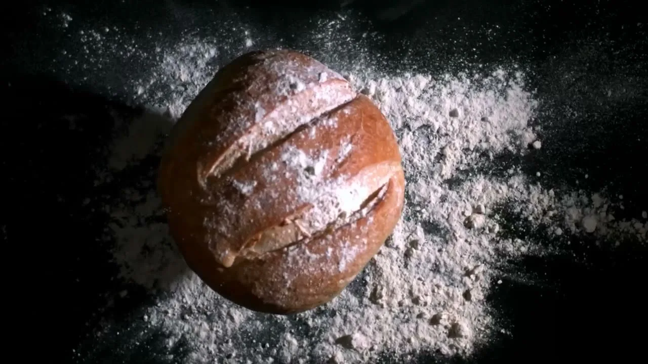 Bread landing in flour, from the Fornace reel